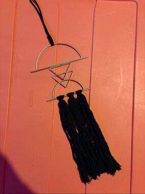 Geometric Silver Wall Hanging with Black Tassels